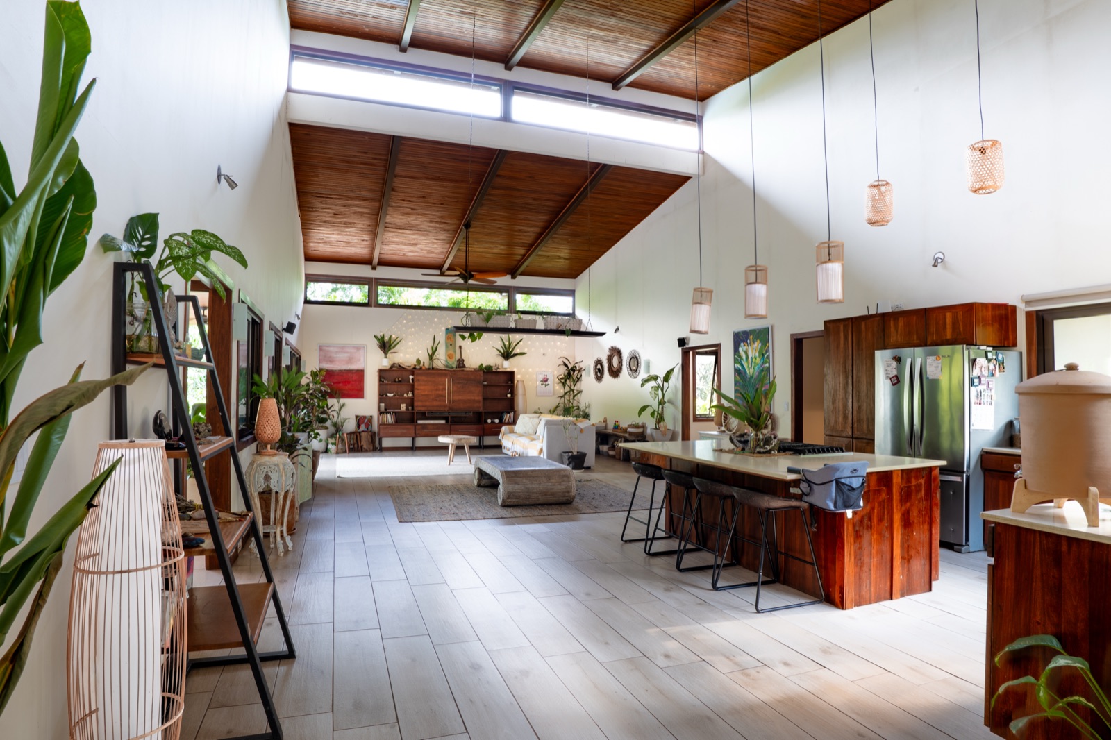 Open-plan living space with vaulted wood ceiling