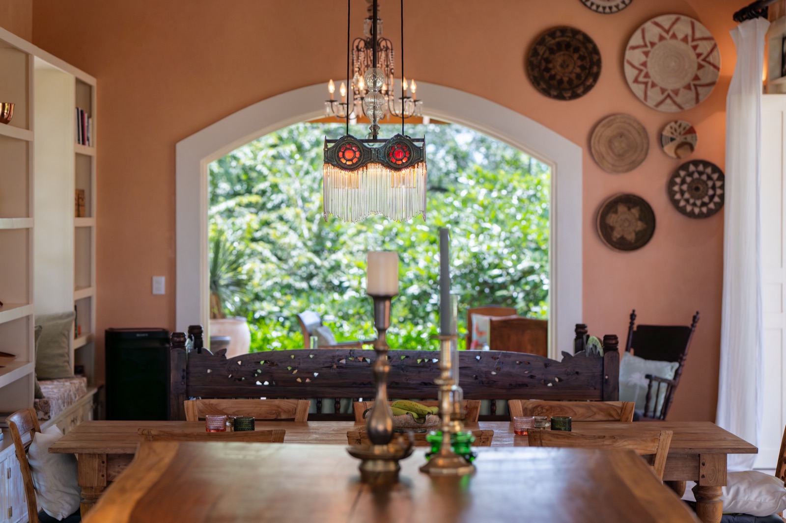 Dining room with arched window and chandelier