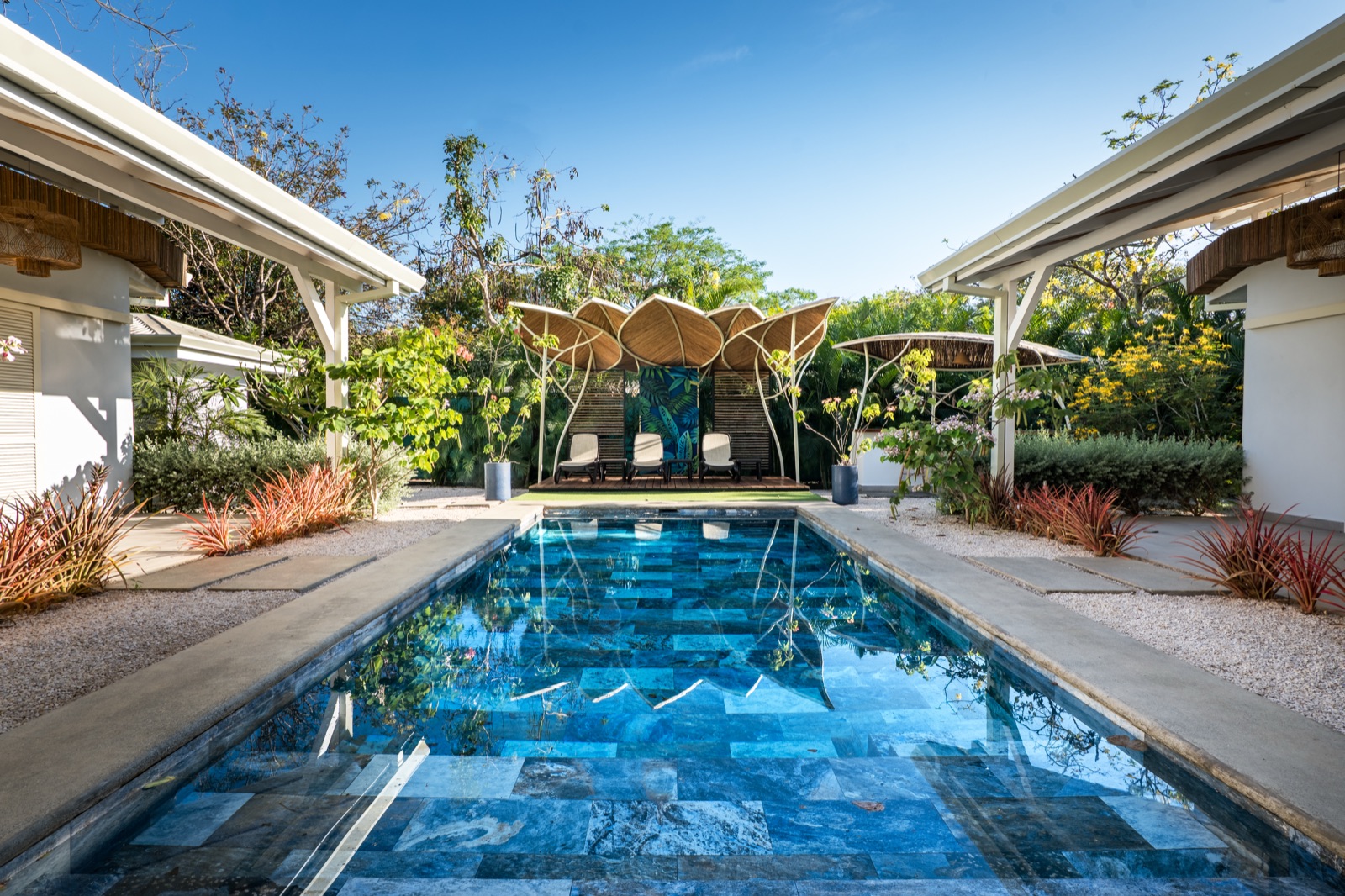 Pool area with decorative loungers