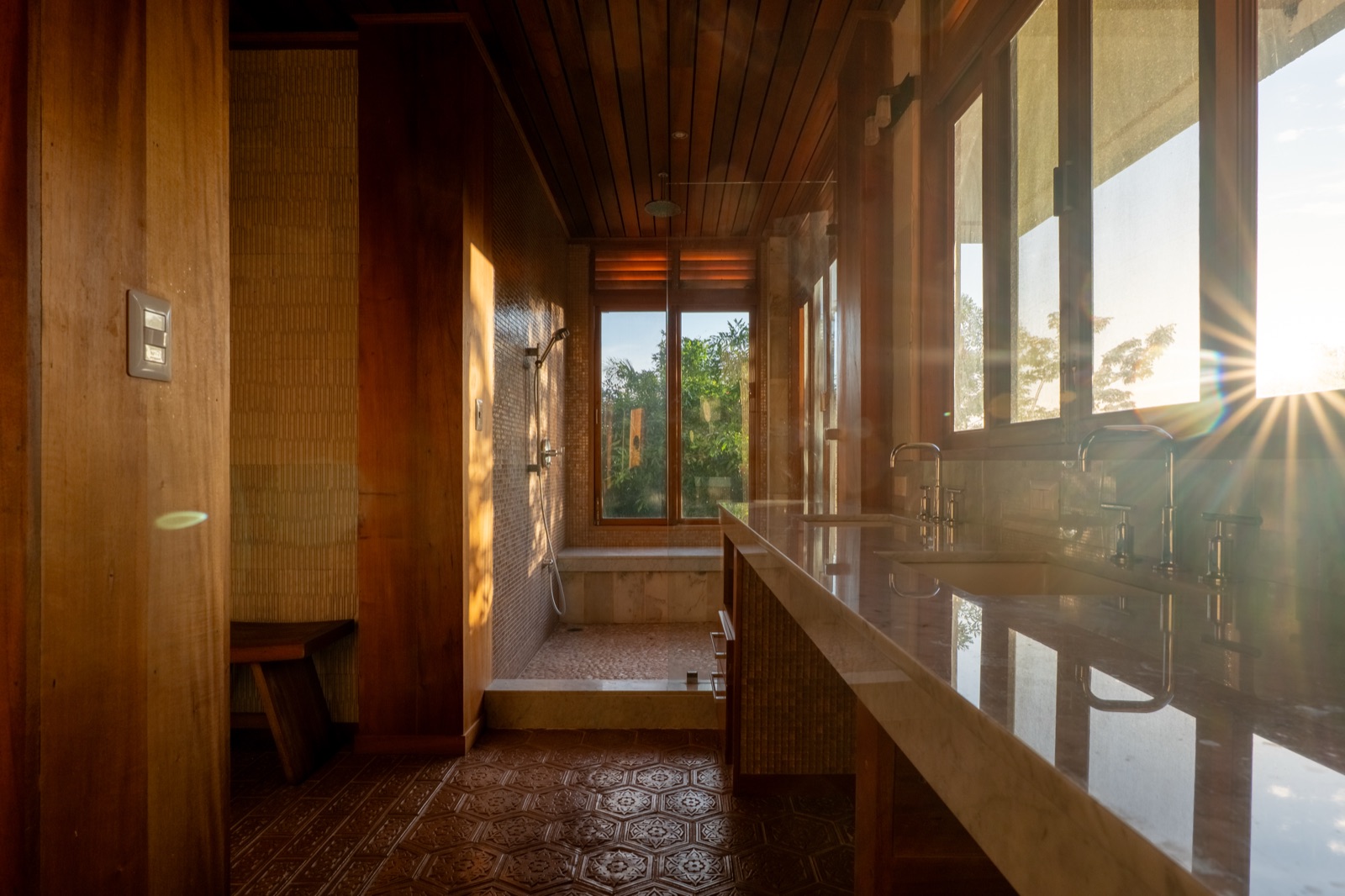 Wooden bathroom with sunset light streaming in